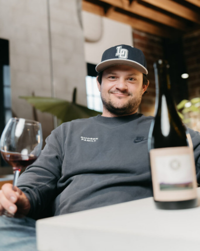 L'Angelo Winemaker Chase Renton enjoynig a glass of wine